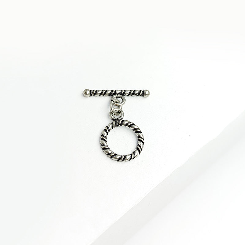 Decorative Silver Overlay toggle clasp with twisted rope bar and circular loop, oxidized finish, artisan jewelry fastener for bracelets and necklaces.