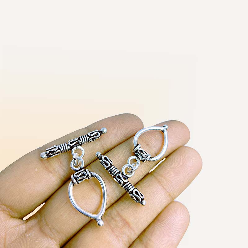 Bulk Silver Overlay teardrop toggle fastener with decorative bar, wholesale Bali jewelry finding for bracelets and necklaces.