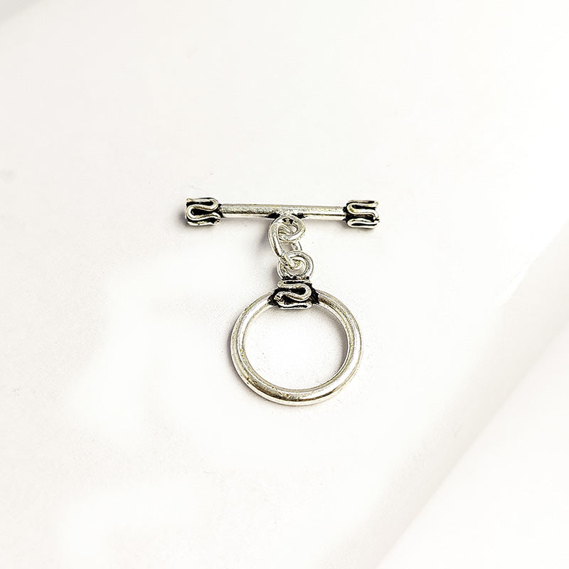 Handcrafted antique Silver Overlay toggle clasp with circular ring and folded edge detailing, Bali jewelry closure for necklaces and bracelets.