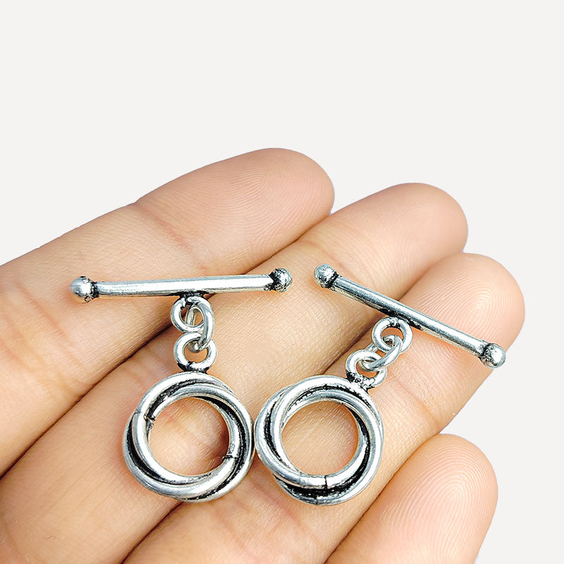 Handcrafted antique Silver Overlay toggle clasp with interlocking double rings and straight bar, Bali jewelry closure for necklaces and bracelets.