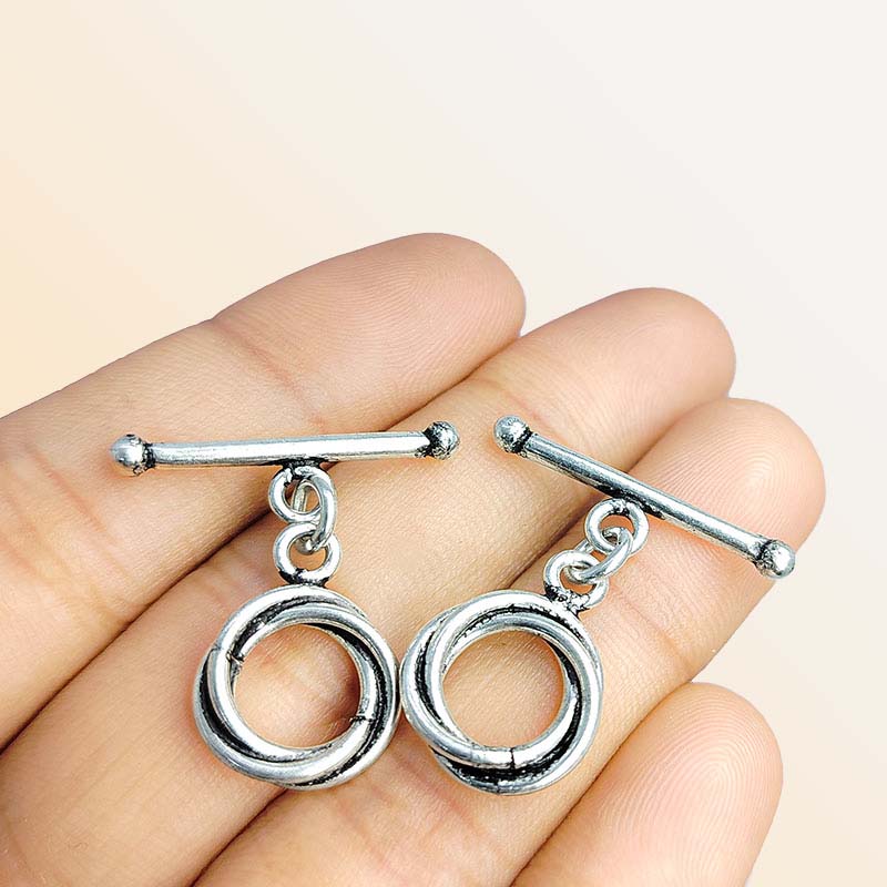 Handcrafted antique Silver Overlay toggle clasp with interlocking double rings and straight bar, Bali jewelry closure for necklaces and bracelets.