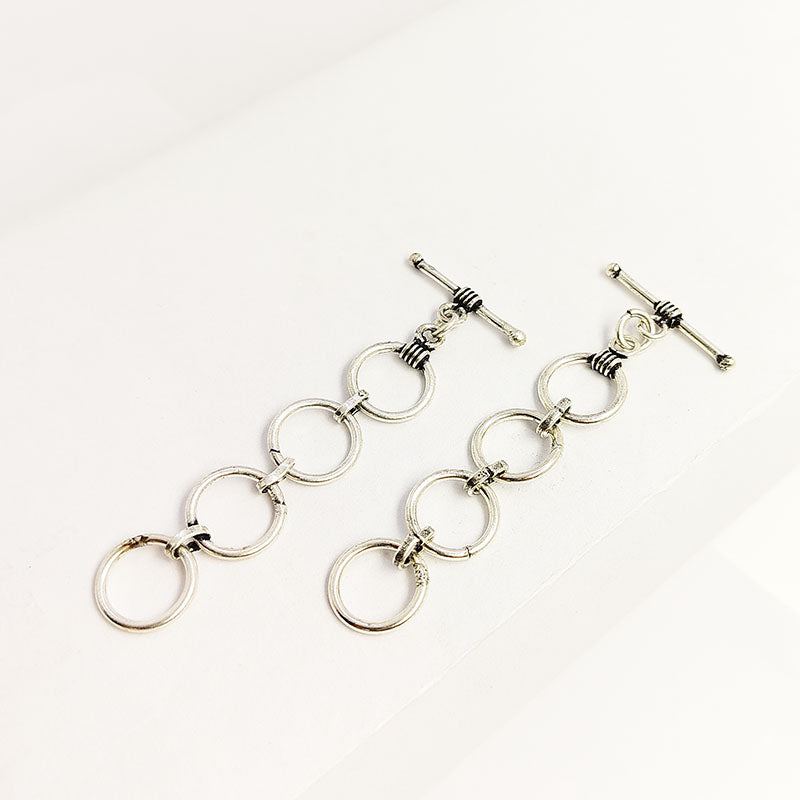 Elegant Silver Overlay toggle clasp with four smooth interlinked rings and a polished bar closure, perfect for bracelets, necklaces, and DIY jewelry projects.