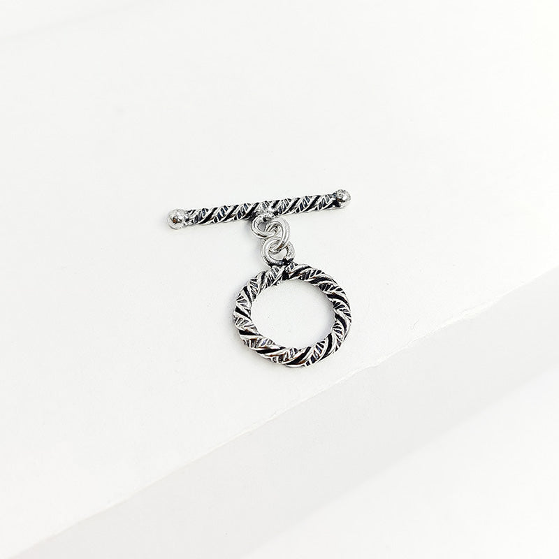 Elegant Silver Overlay oval toggle clasp, handcrafted in Bali – textured loop and bar closure for necklaces and bracelets.