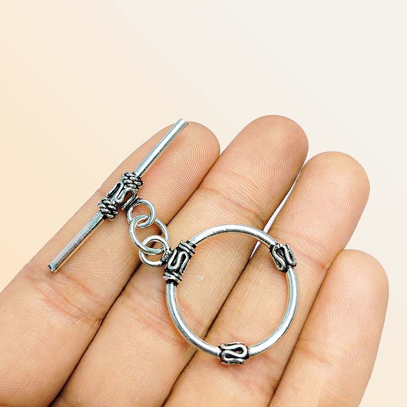 Elegant Silver Overlay decorative oval toggle clasp, handcrafted in India – polished loop and bar closure for necklaces and bracelets.