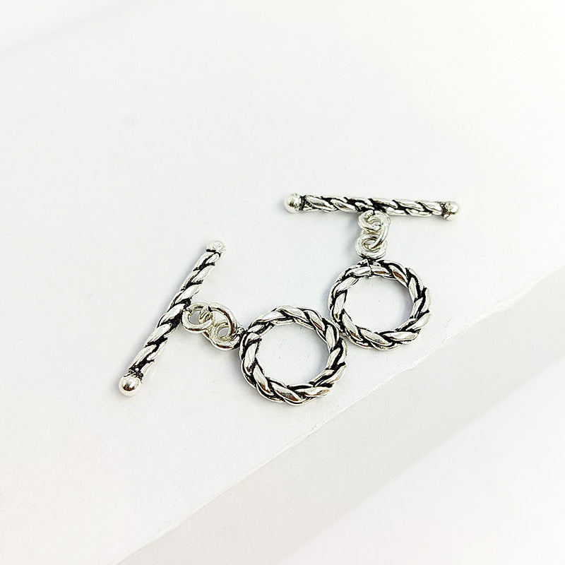 Polished Silver Overlay rope toggle closure with twisted design, handcrafted in India for bracelets and necklaces.