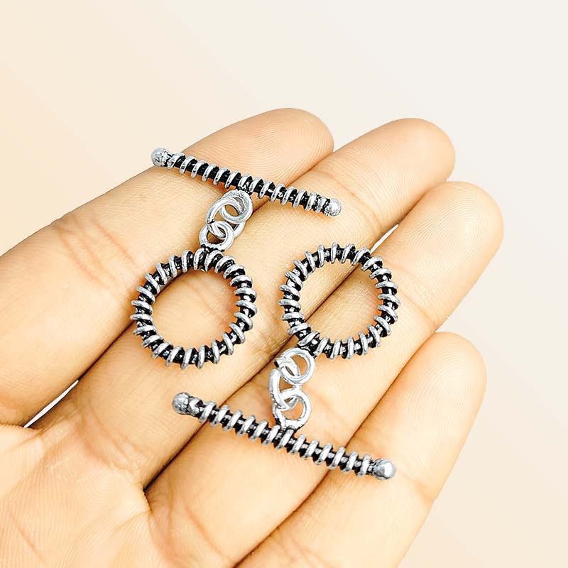 Elegant Silver Overlay textured toggle clasp with detailed circular loop and ridged bar design, perfect for necklaces and bracelets, handcrafted in India.