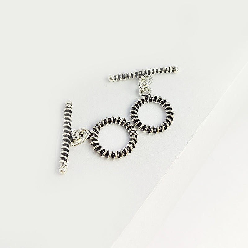 Elegant Silver Overlay textured toggle clasp with detailed circular loop and ridged bar design, perfect for necklaces and bracelets, handcrafted in India.