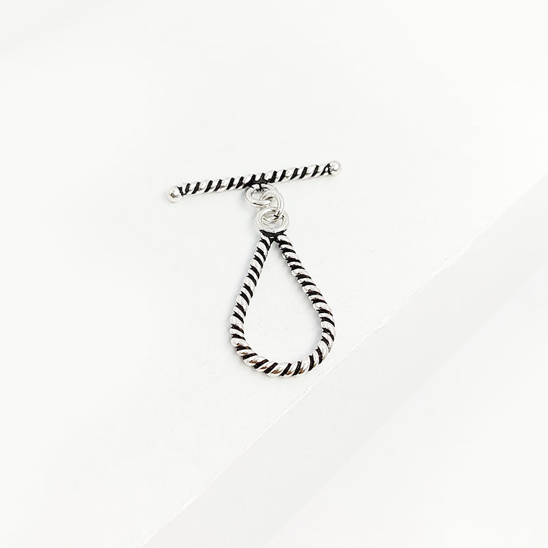 Elegant Silver Overlay teardrop rope toggle clasp with twisted loop and polished bar design, perfect for necklaces and bracelets, handcrafted in India.