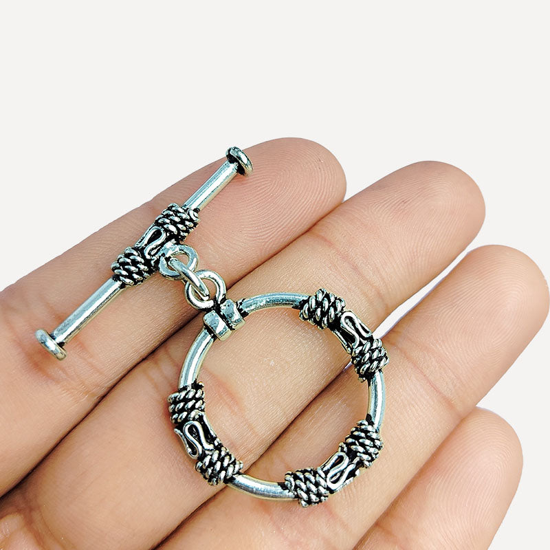 Elegant Silver Overlay ornate circular toggle clasp with rope-wrapped loop and polished bar design, perfect for necklaces and bracelets, handcrafted in India.