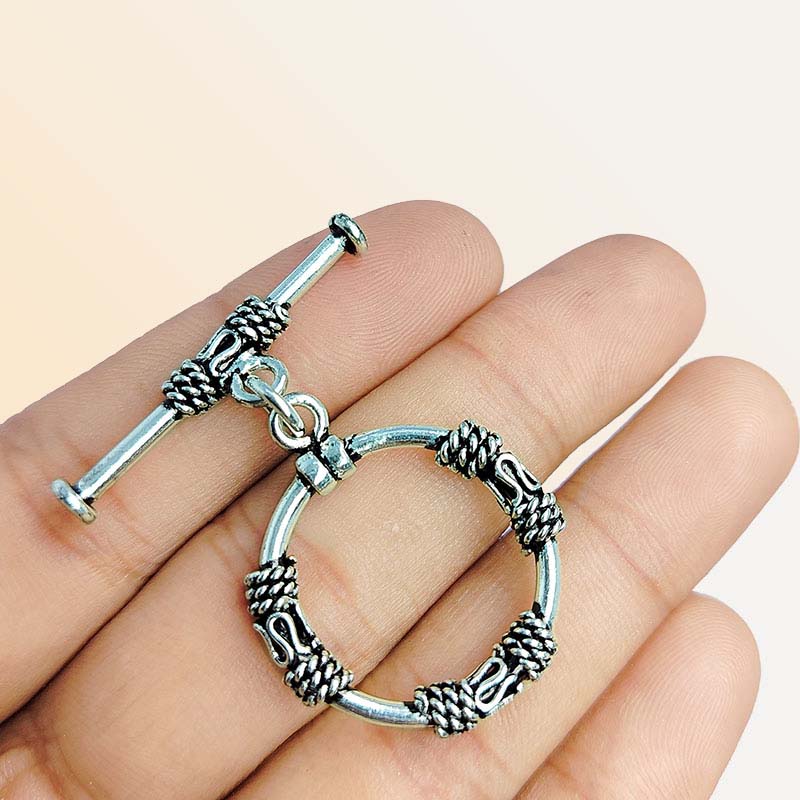 Elegant Silver Overlay ornate circular toggle clasp with rope-wrapped loop and polished bar design, perfect for necklaces and bracelets, handcrafted in India.