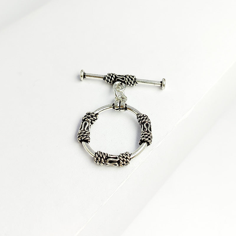 Elegant Silver Overlay ornate circular toggle clasp with rope-wrapped loop and polished bar design, perfect for necklaces and bracelets, handcrafted in India.