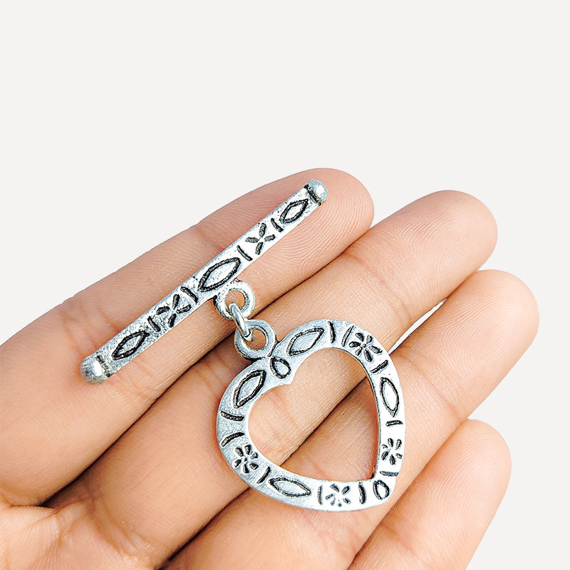 Elegant Silver Overlay floral heart toggle clasp with engraved heart-shaped loop and polished bar design, perfect for necklaces and bracelets, handcrafted in India.