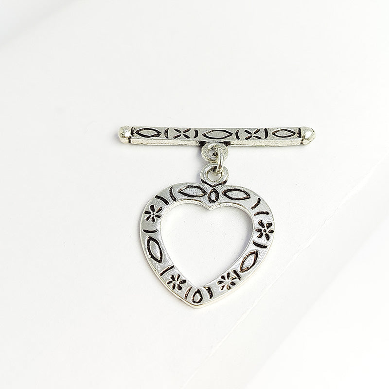 Elegant Silver Overlay floral heart toggle clasp with engraved heart-shaped loop and polished bar design, perfect for necklaces and bracelets, handcrafted in India.
