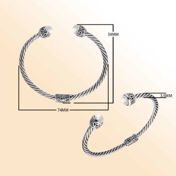 Sterling silver cuff bangle with luminous pearls and Balinese detailing, handmade in Bali.