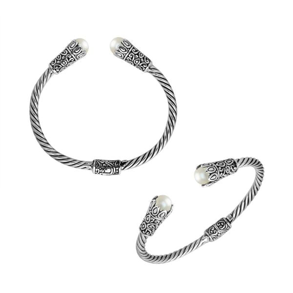 Handmade pearl silver bangle with twisted cable design and Balinese carvings