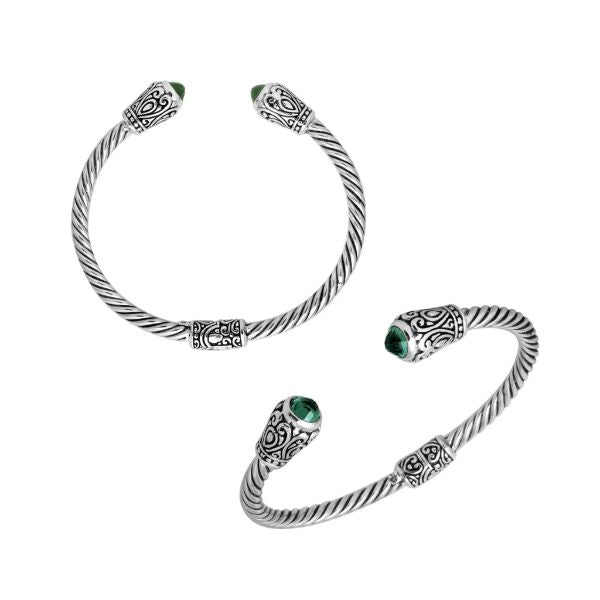 Handmade silver bangle with green quartz ends and Balinese carved design