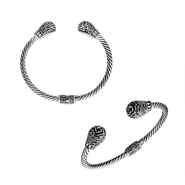 Handmade sterling silver bangle with twisted cable and Balinese carved ends