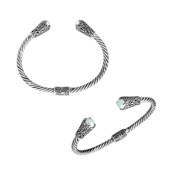 Handmade silver bangle with pearl ends and Balinese carved design