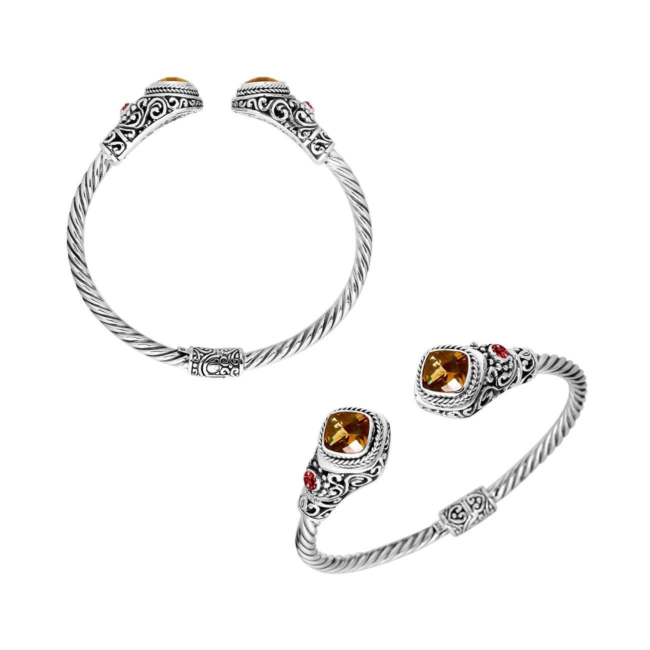 Handcrafted Sterling Silver bangle with Citrine Quartz and Garnet Quartz stones, artisan-made in Bali.