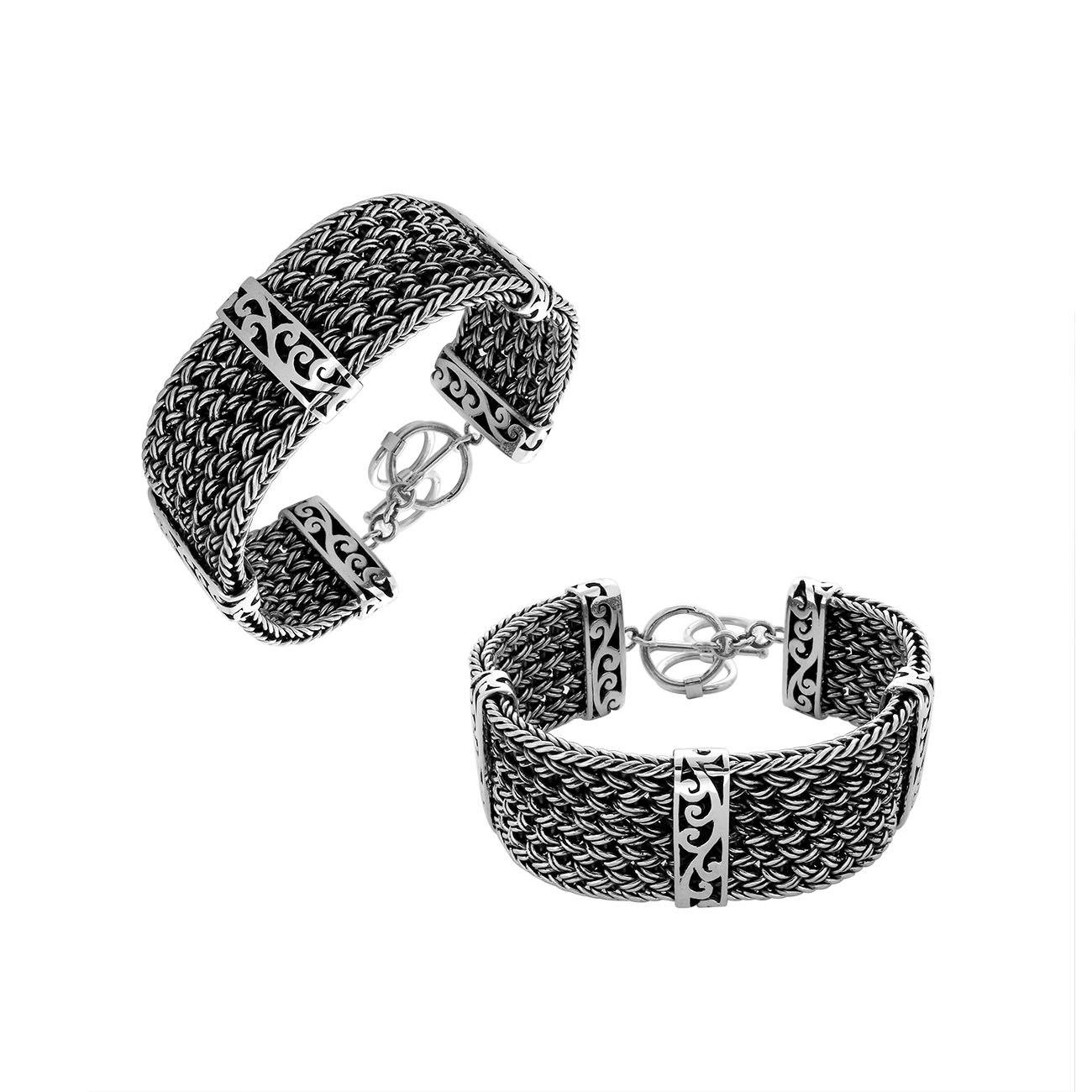 Wide braided sterling silver bracelet with scroll design and toggle clasp