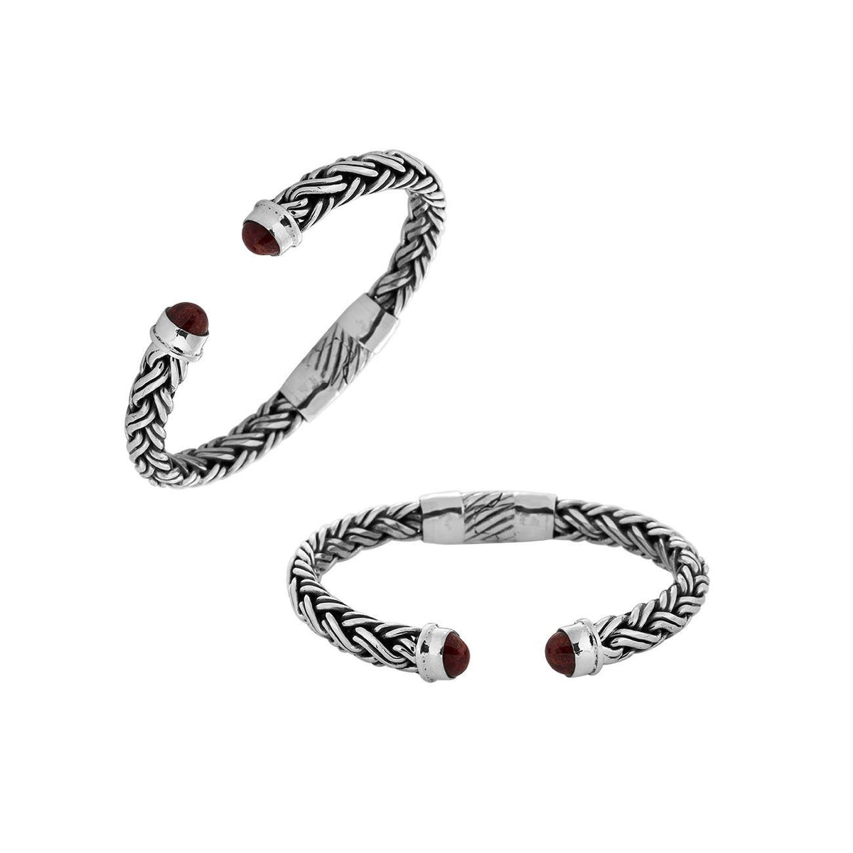 Handcrafted sterling silver bangle with Coral stones in Balinese braided design.