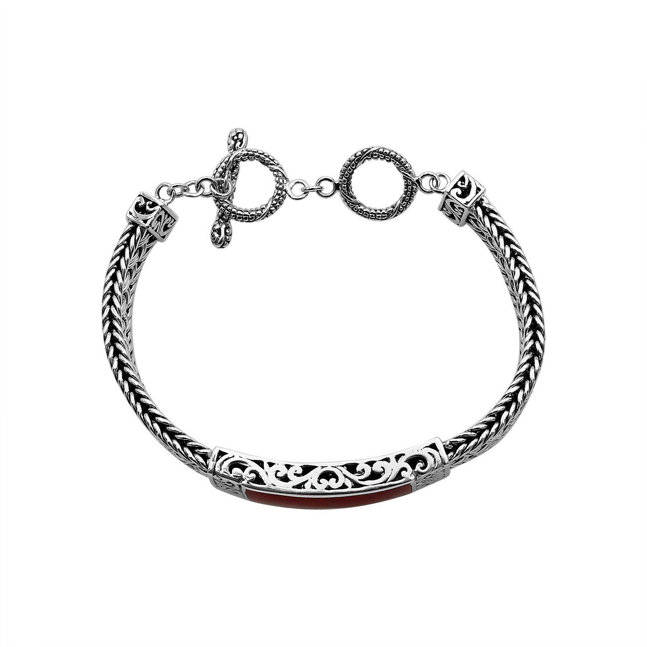Handcrafted sterling silver bracelet with Coral inlay and toggle lock made in Bali.