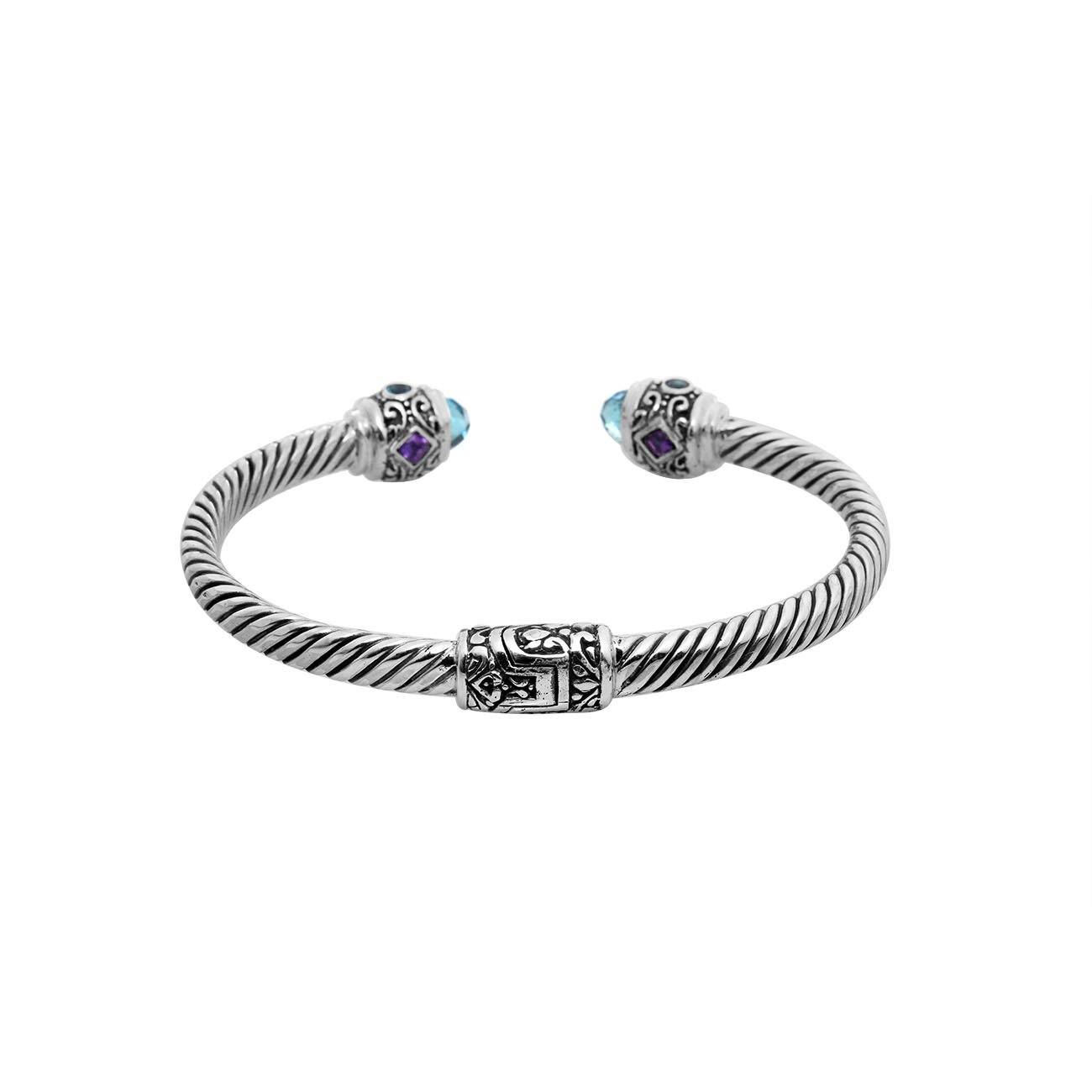 Handcrafted sterling silver bangle with Blue Topaz Quartz and Amethyst Quartz stones made in Bali.