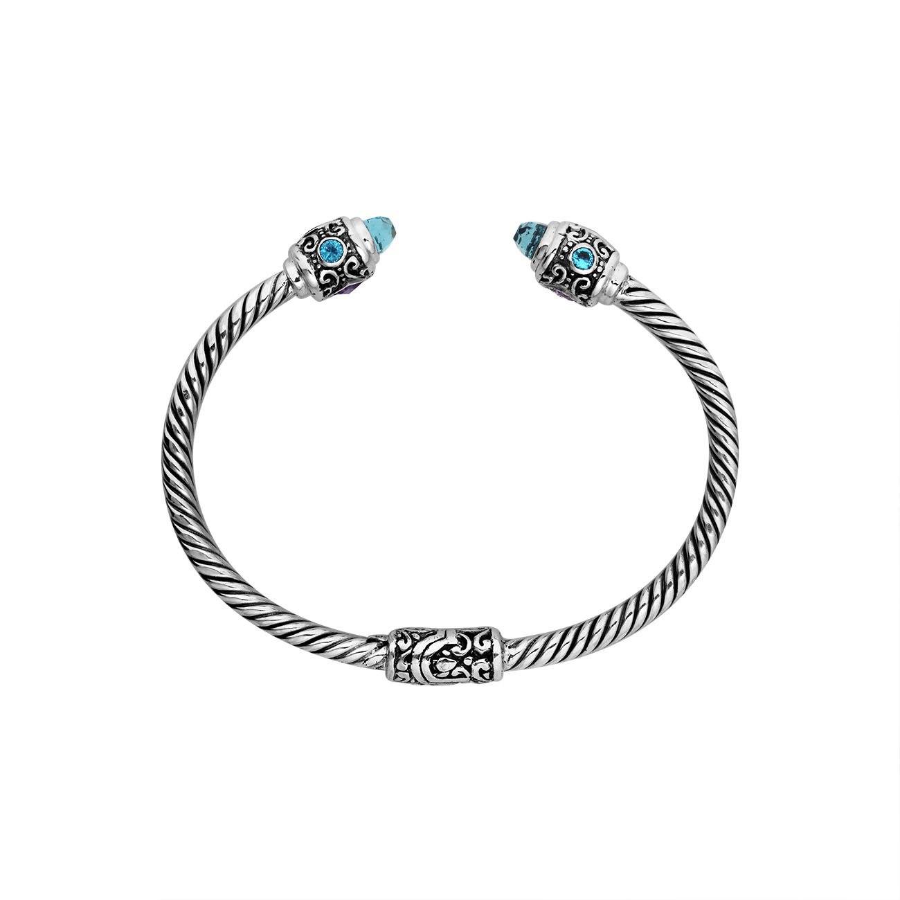 Handcrafted sterling silver bangle with Blue Topaz Quartz and Amethyst Quartz stones made in Bali.