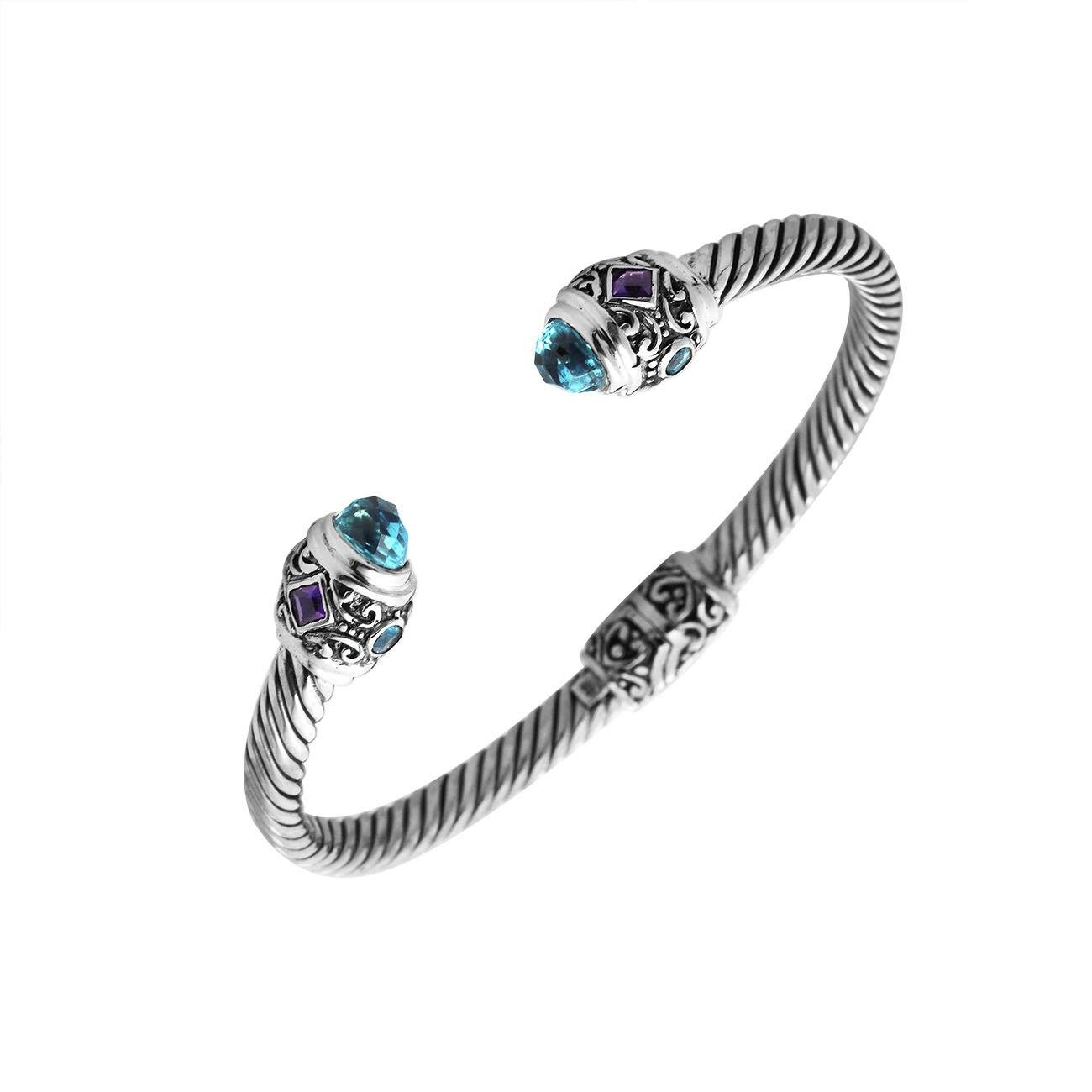 Handcrafted sterling silver bangle with Blue Topaz Quartz and Amethyst Quartz stones made in Bali.