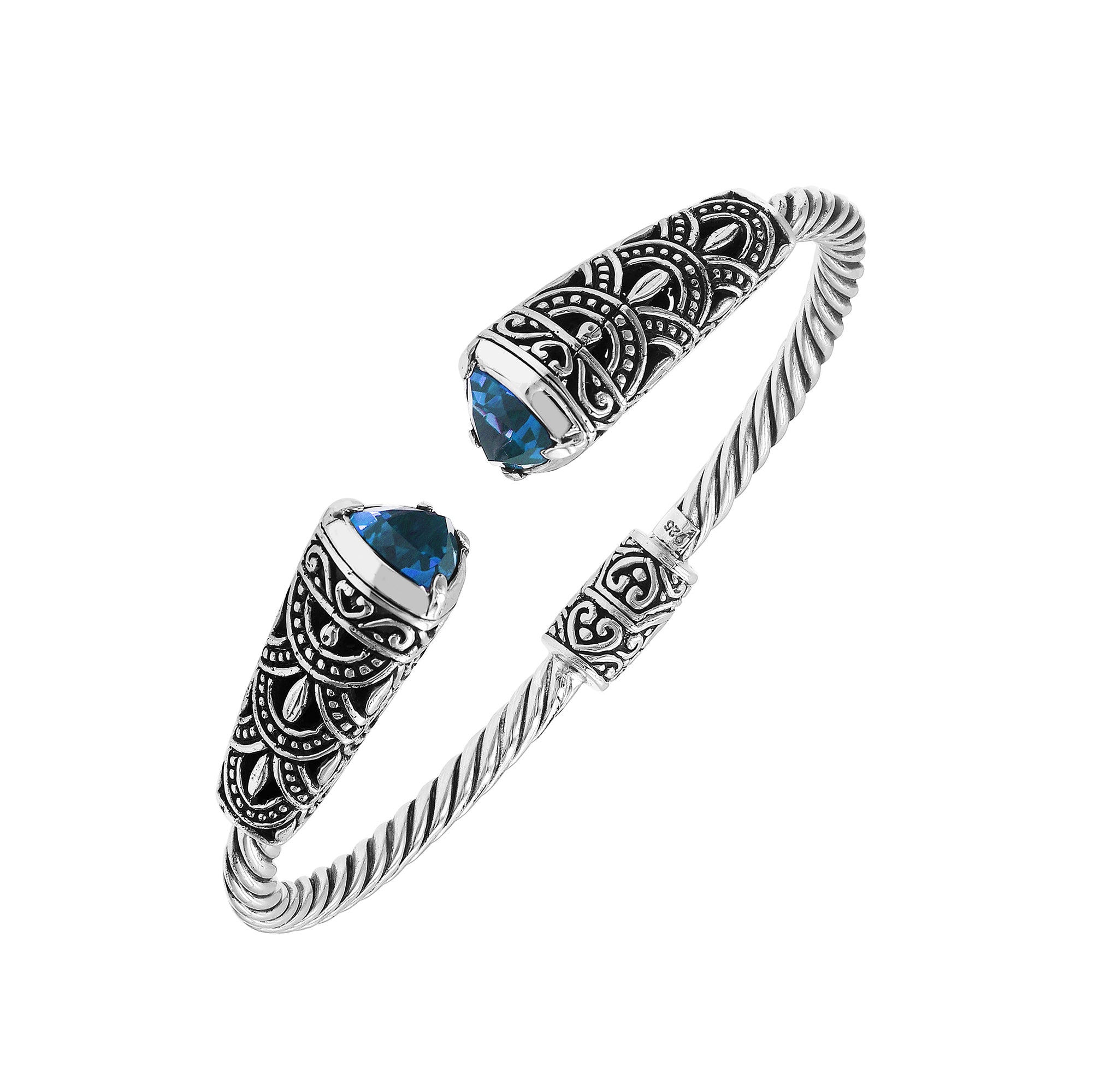 Elegant sterling silver open bangle with blue topaz quartz accents and Balinese detailing