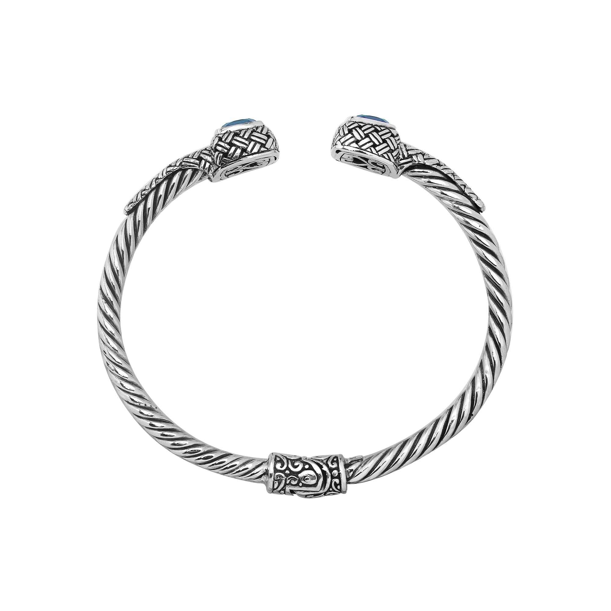 Elegant sterling silver braided bangle with blue topaz quartz accents and intricate Balinese pattern
