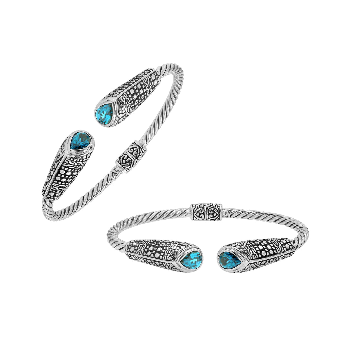 Elegant sterling silver open bangle with blue topaz quartz accents and Balinese dot design