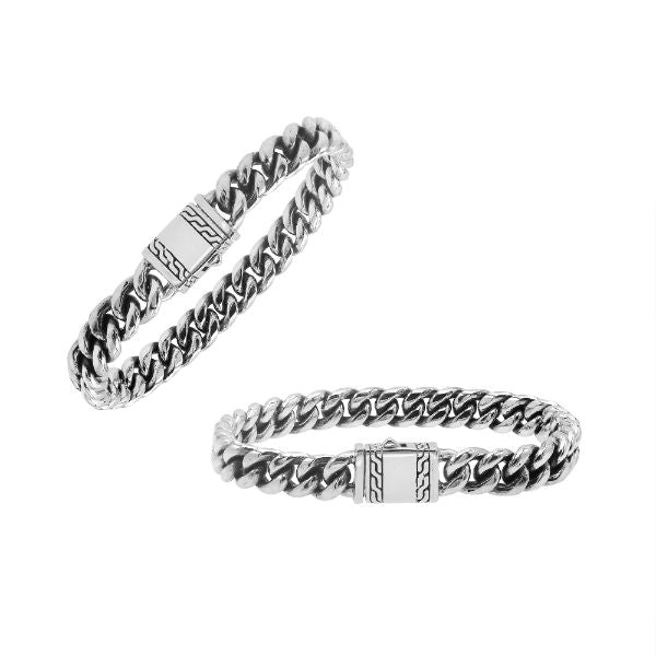 Elegant sterling silver Cuban chain bracelet with polished links and engraved clasp