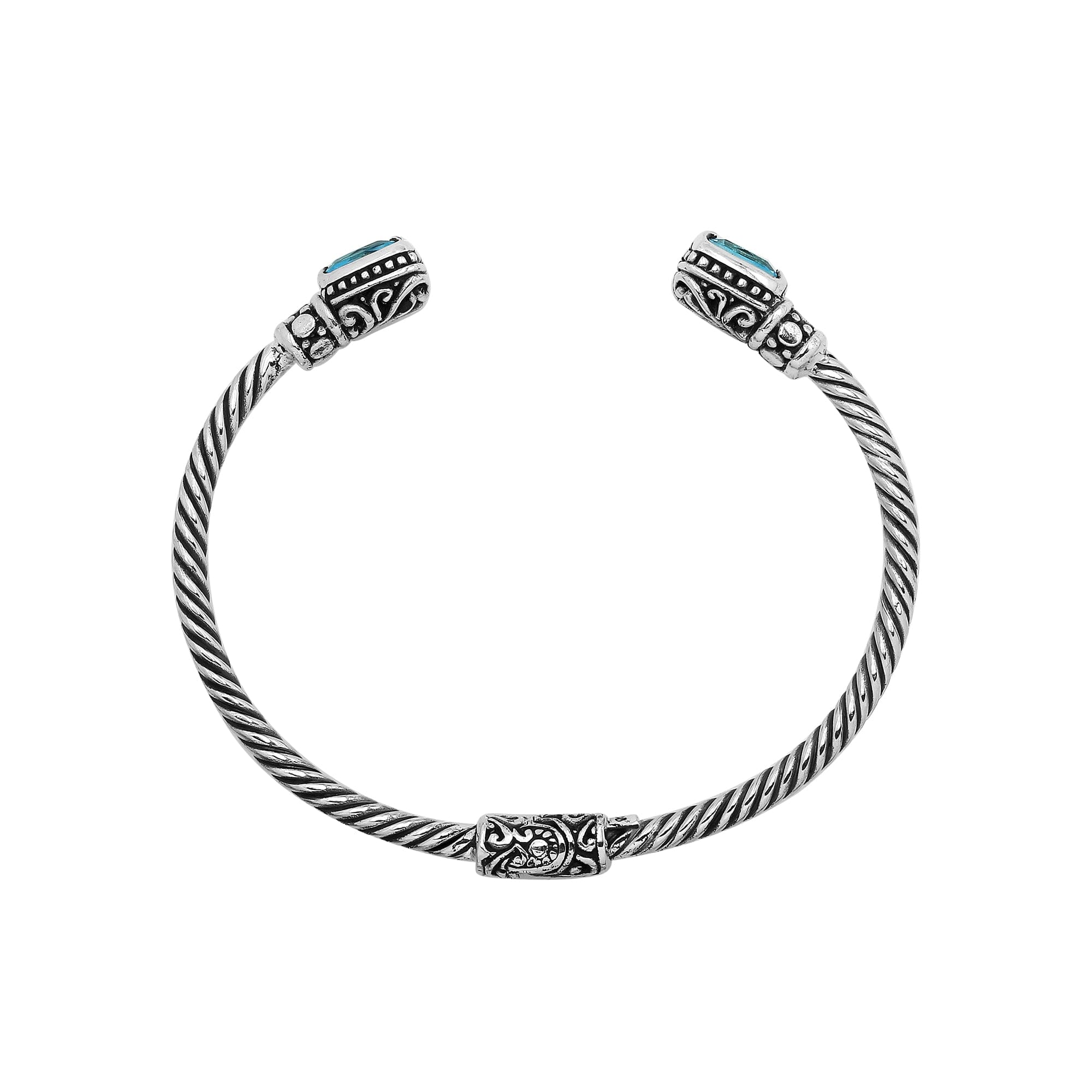 Sterling silver Balinese cuff bangle with Blue Topaz Quartz accents and intricate scroll design.