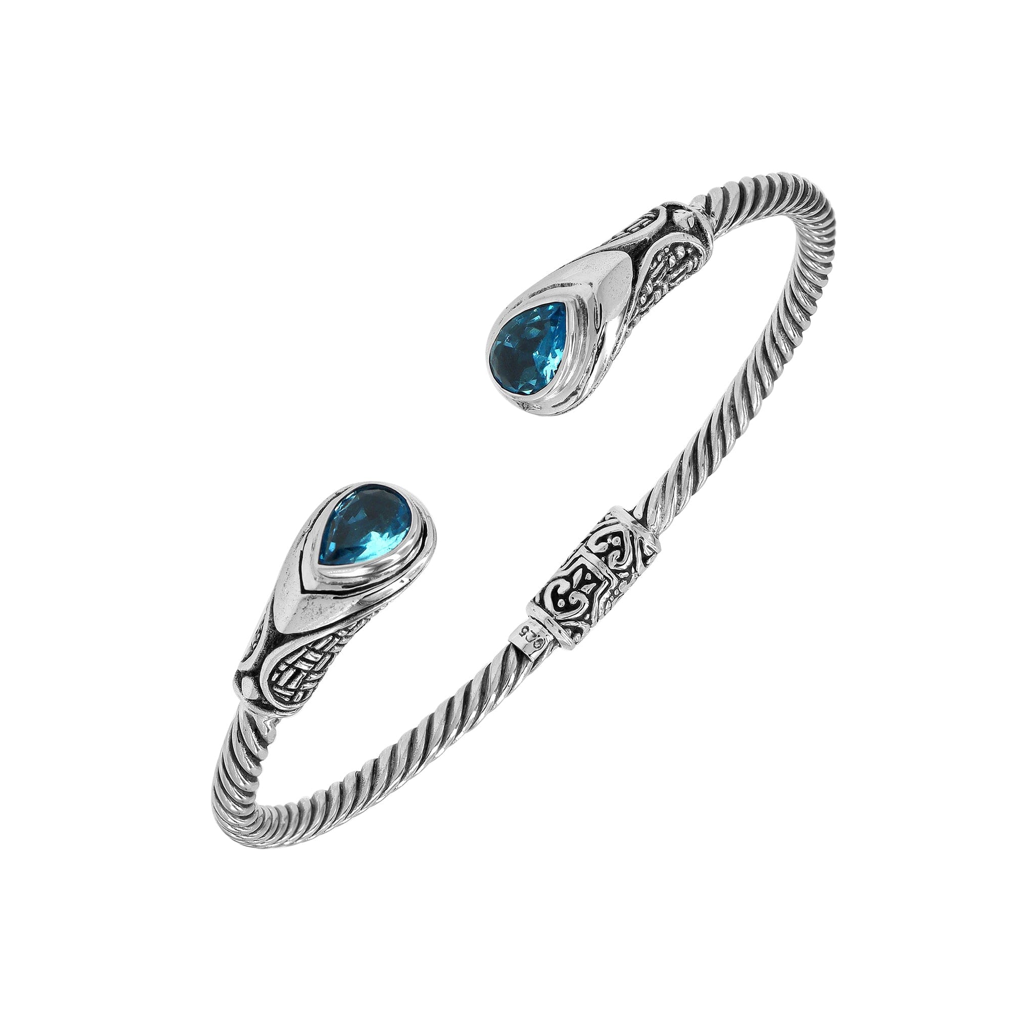 Sterling silver Balinese cuff bangle with Blue Topaz Quartz accents and ornate scroll design.