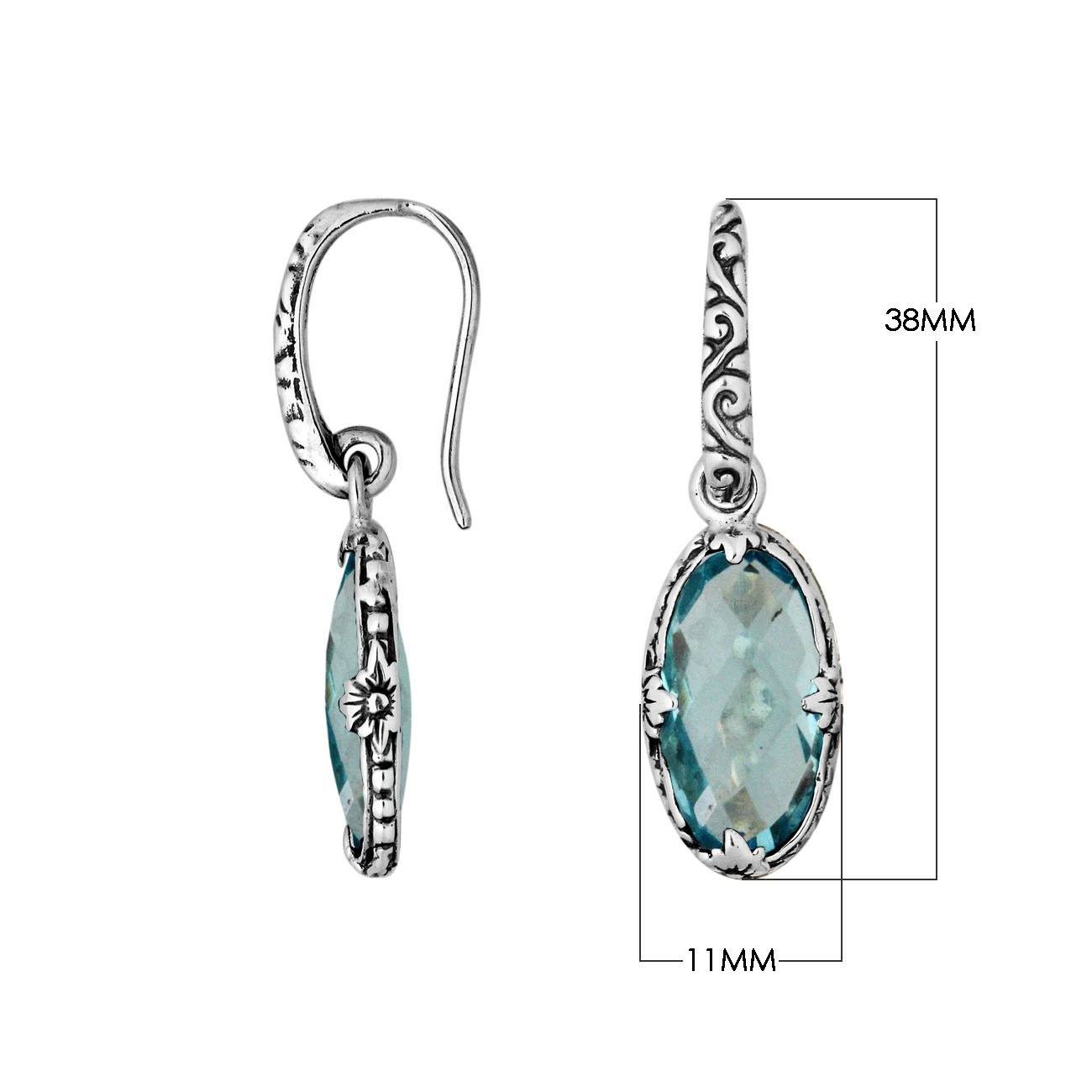 A stunning pair of 925 sterling silver earrings featuring oval Blue Topaz Quartz stones with Balinese floral detailing and earwire hooks for a modern elegant look.