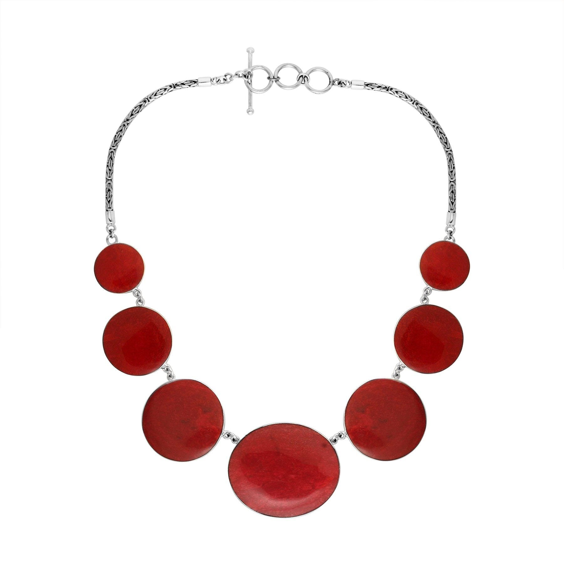 Women’s sterling silver necklace with polished coral discs and Bali-inspired accents.