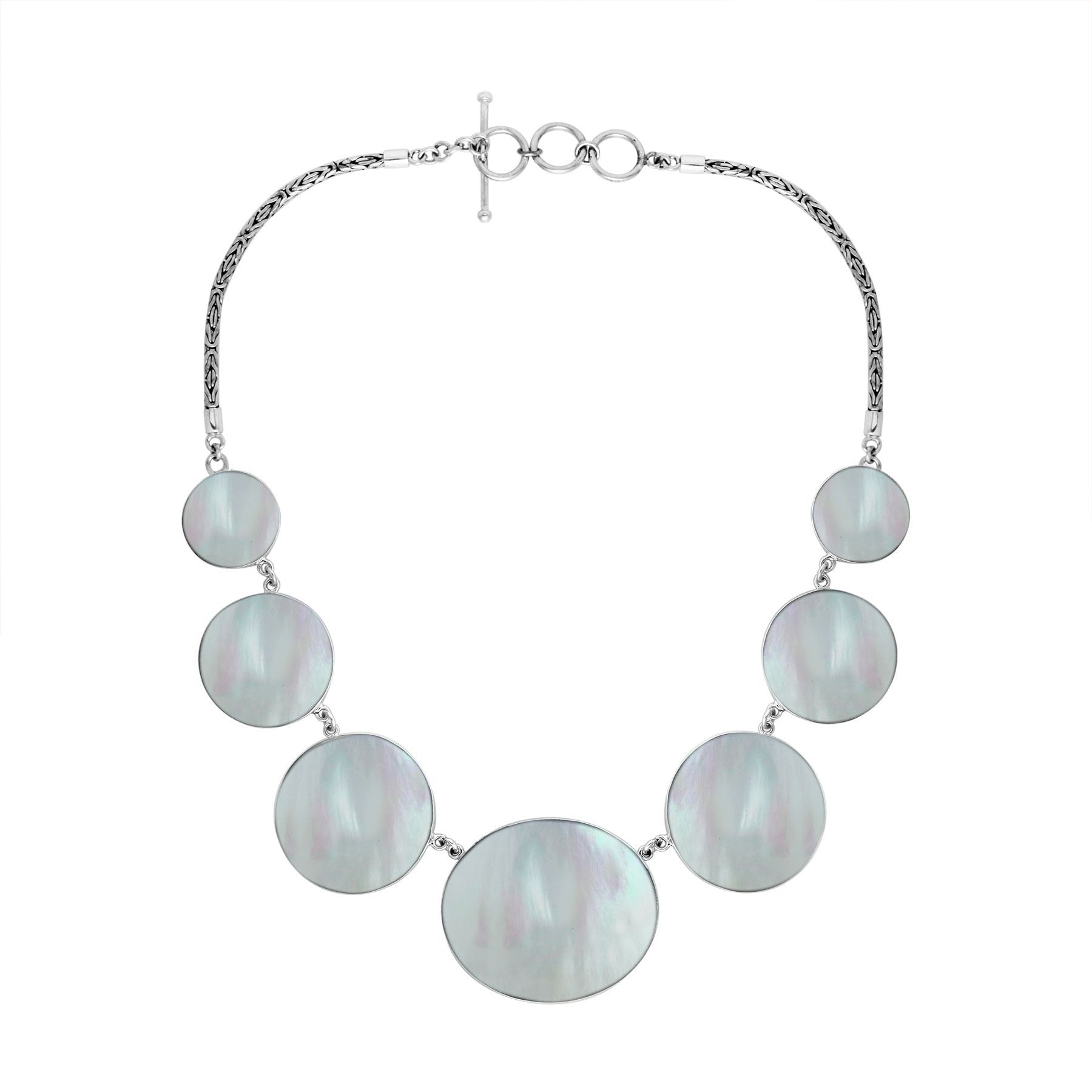 Women’s sterling silver necklace with Mother of Pearl discs and Bali-inspired accents.