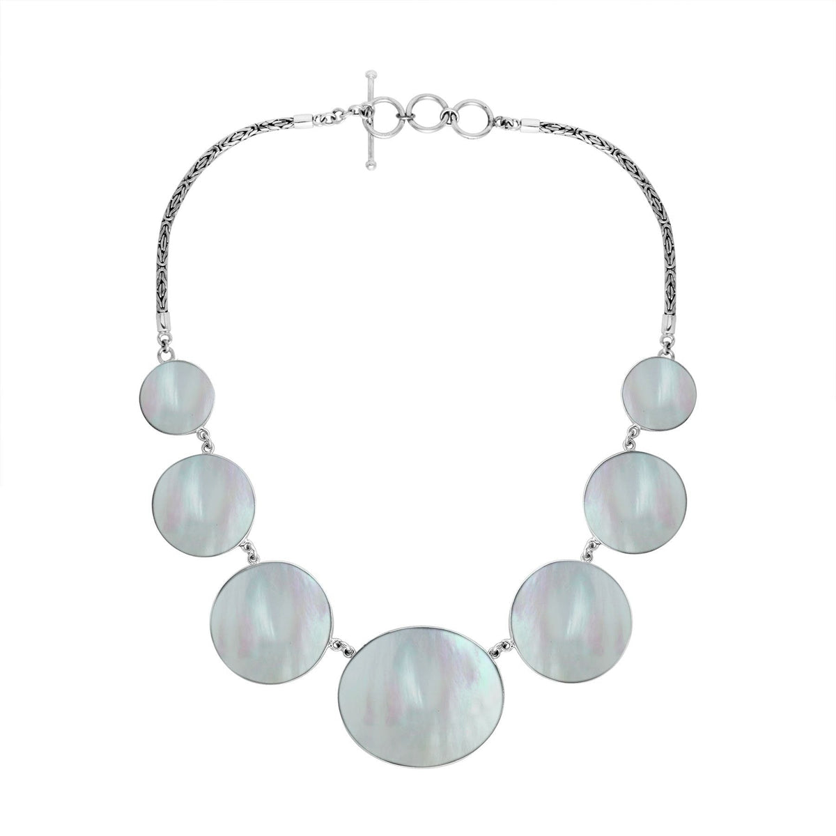 Women’s sterling silver necklace with Mother of Pearl discs and Bali-inspired accents.