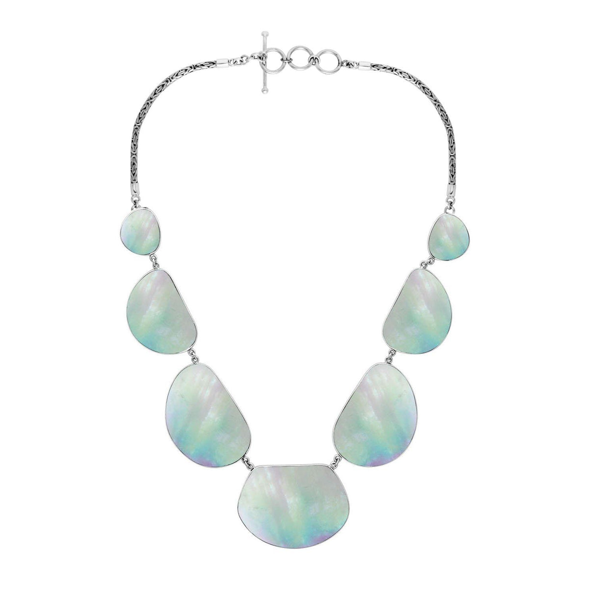 Women’s sterling silver necklace with freeform Mother of Pearl stones and Bali-inspired accents.