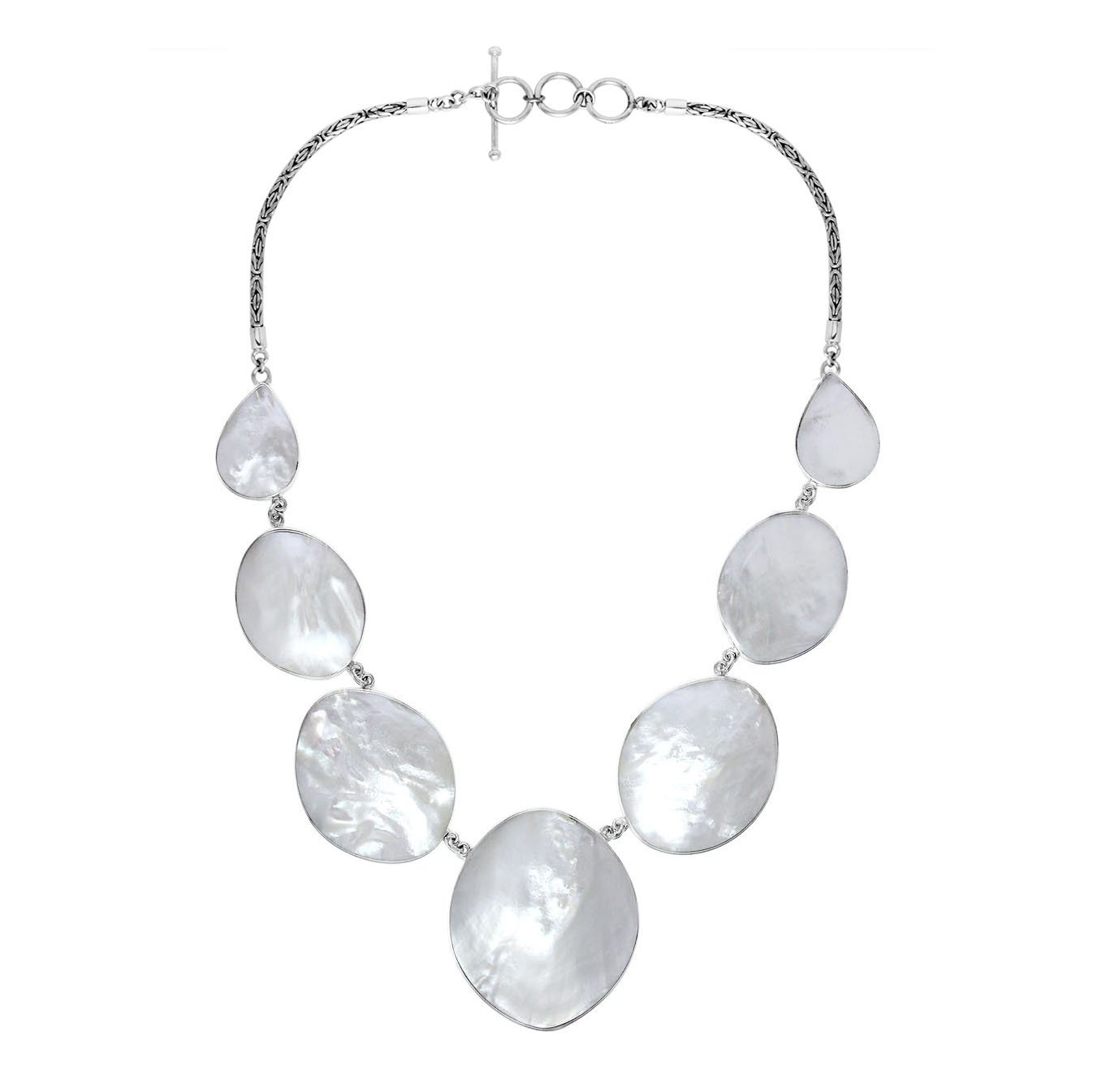 Women’s sterling silver necklace with oval and teardrop Mother of Pearl stones and Bali-inspired accents.