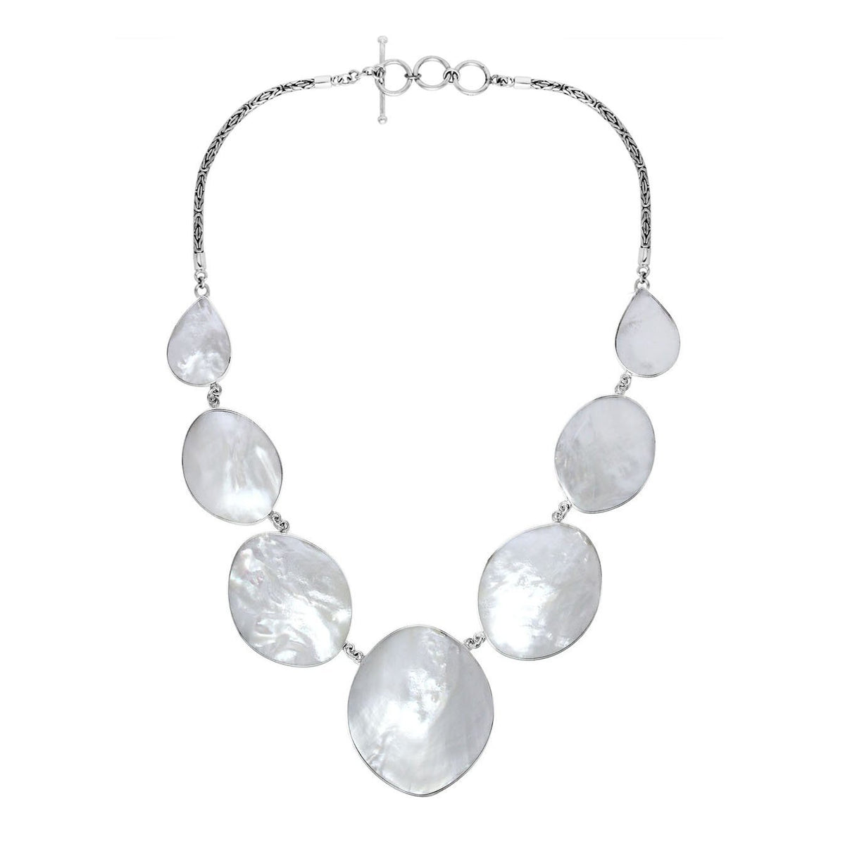 Women’s sterling silver necklace with oval and teardrop Mother of Pearl stones and Bali-inspired accents.