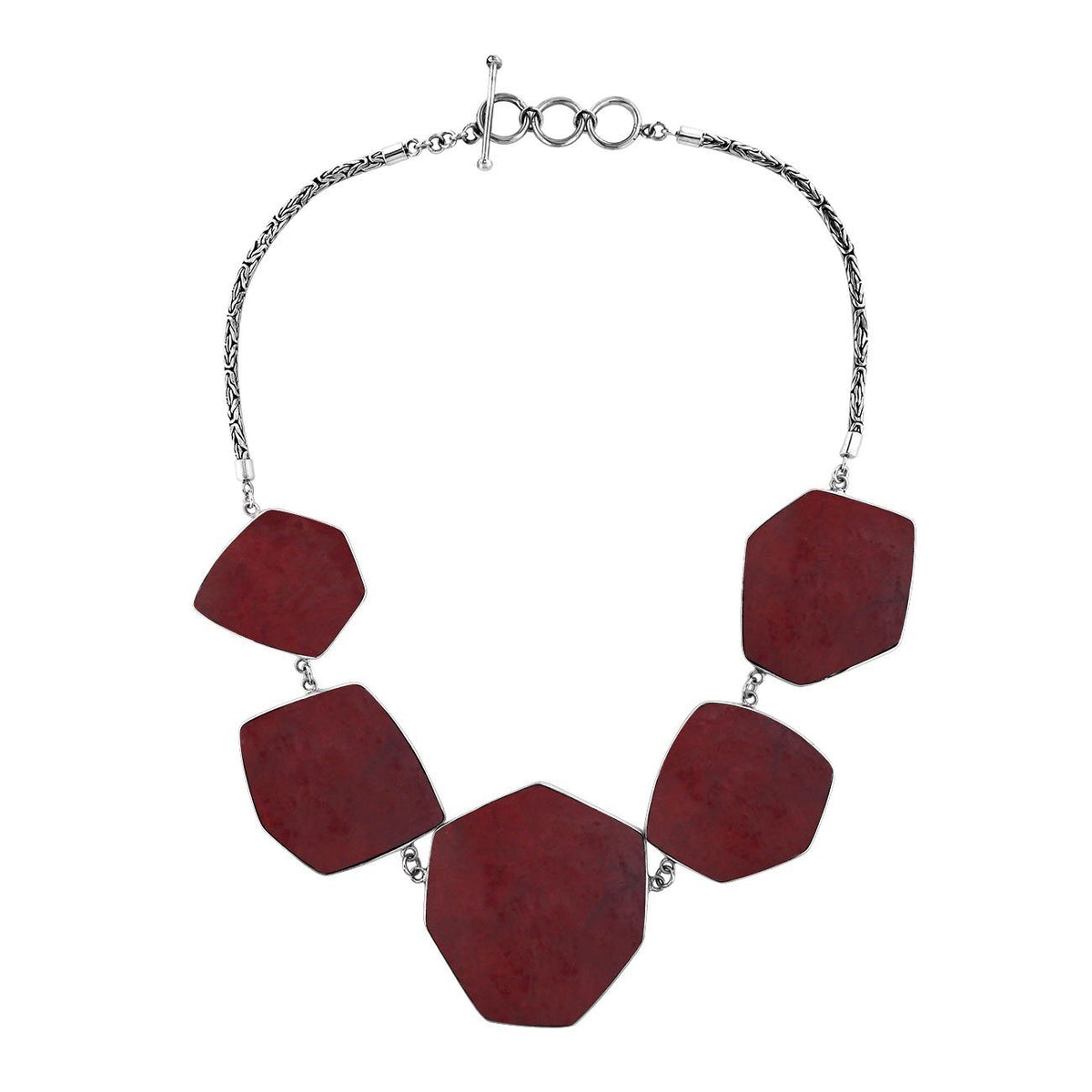 Handcrafted silver necklace with hexagon red coral links in elegant statement design.