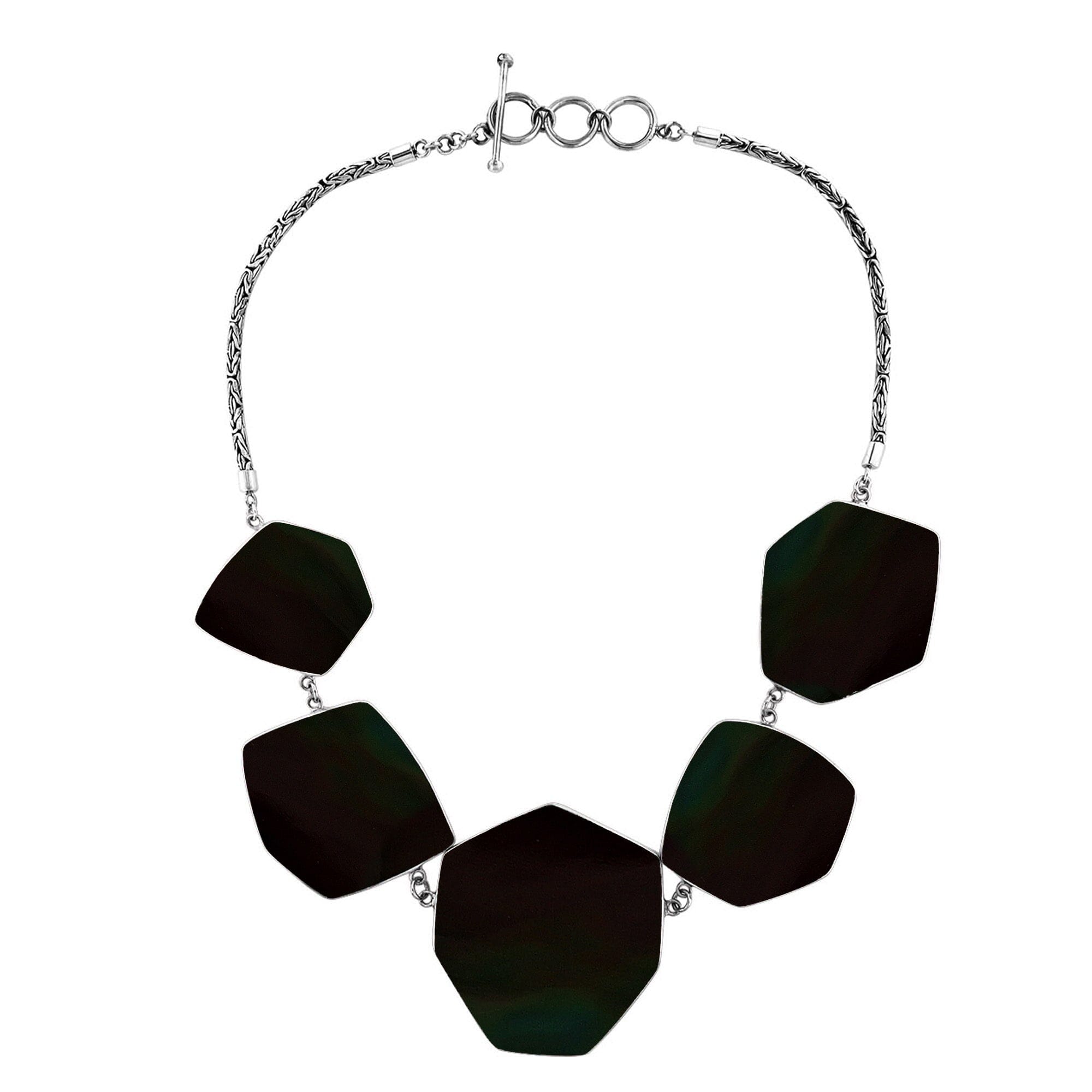 Handcrafted silver necklace with hexagon black shell links in artisan statement design.