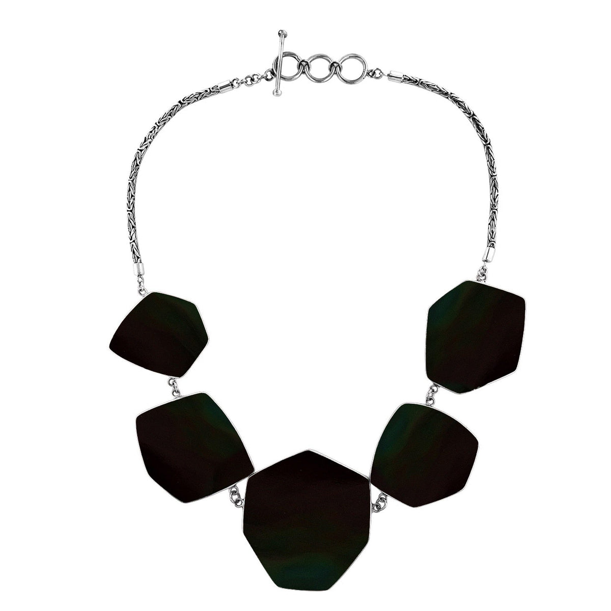 Handcrafted silver necklace with hexagon black shell links in artisan statement design.