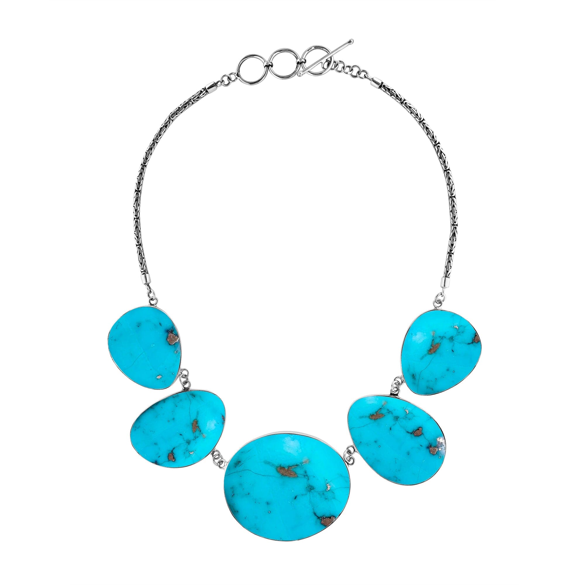 Handcrafted silver necklace with oval turquoise shell links in bold artisan design.