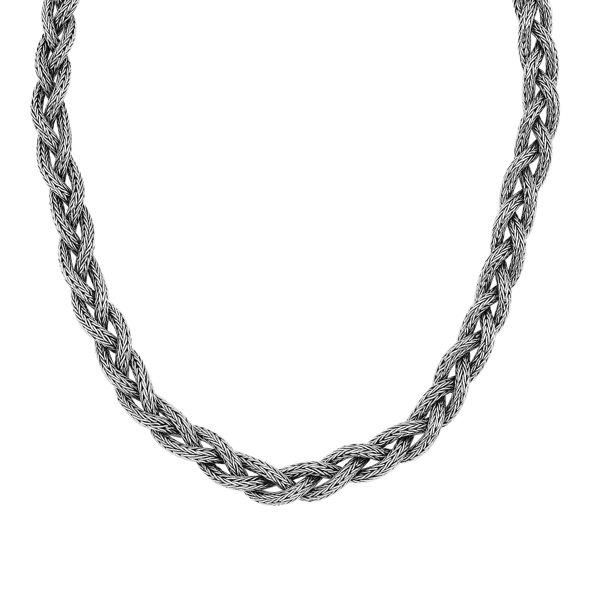 Handcrafted sterling silver braided chain necklace with ornate clasp.