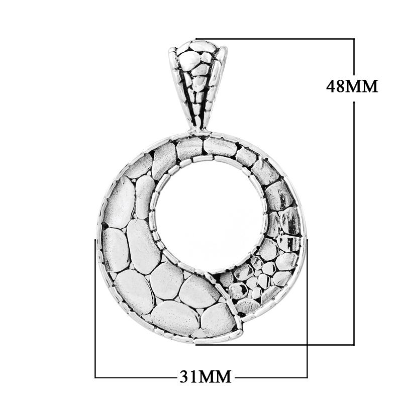 Handcrafted sterling silver round pendant with pebble-textured design and open circle center, artisan Bali jewelry for everyday elegance.