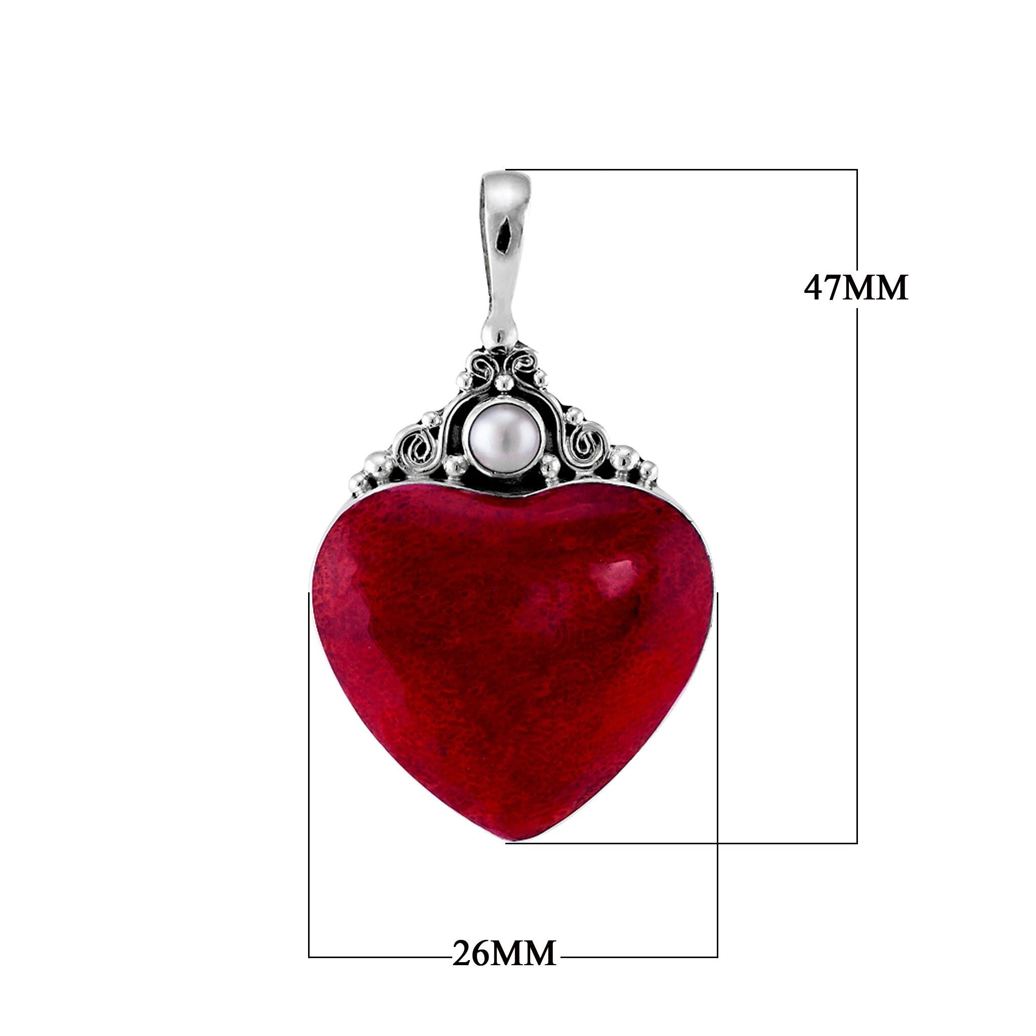 Handcrafted sterling silver heart pendant with vibrant red coral centerpiece and luminous Mother of Pearl accent, artisan Bali jewelry for timeless elegance.