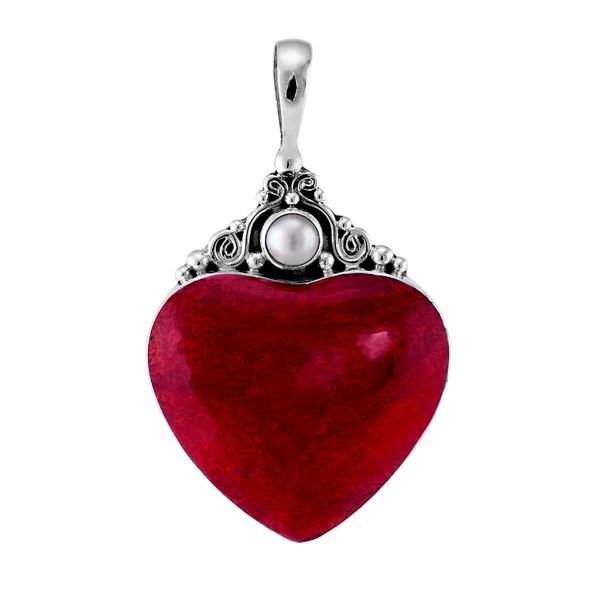 Handcrafted sterling silver heart pendant with vibrant red coral centerpiece and luminous Mother of Pearl accent, artisan Bali jewelry for timeless elegance.